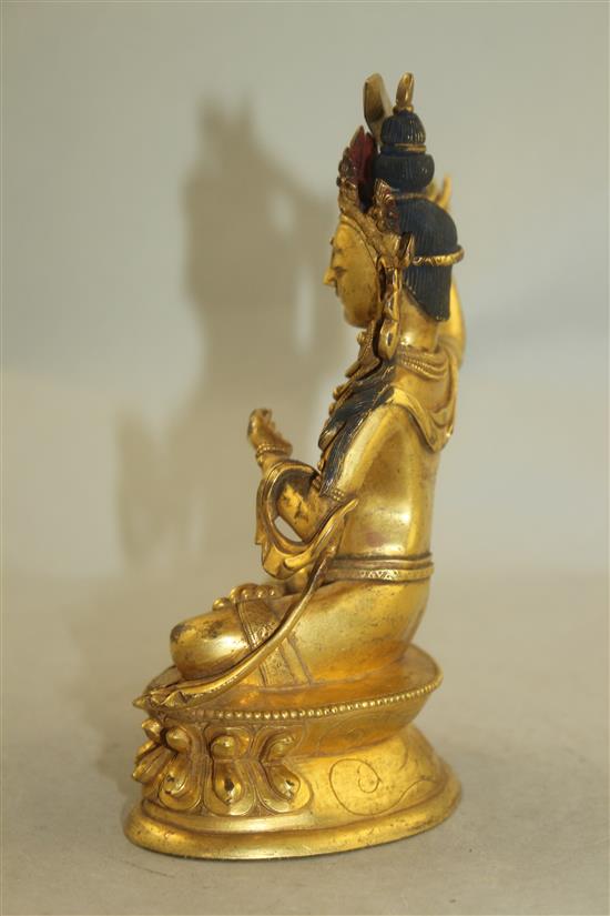 A Tibetan gilt bronze figure of Manjushri, 18cm